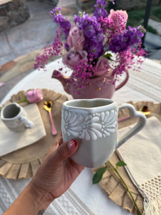 white & gray heart shaped taza
