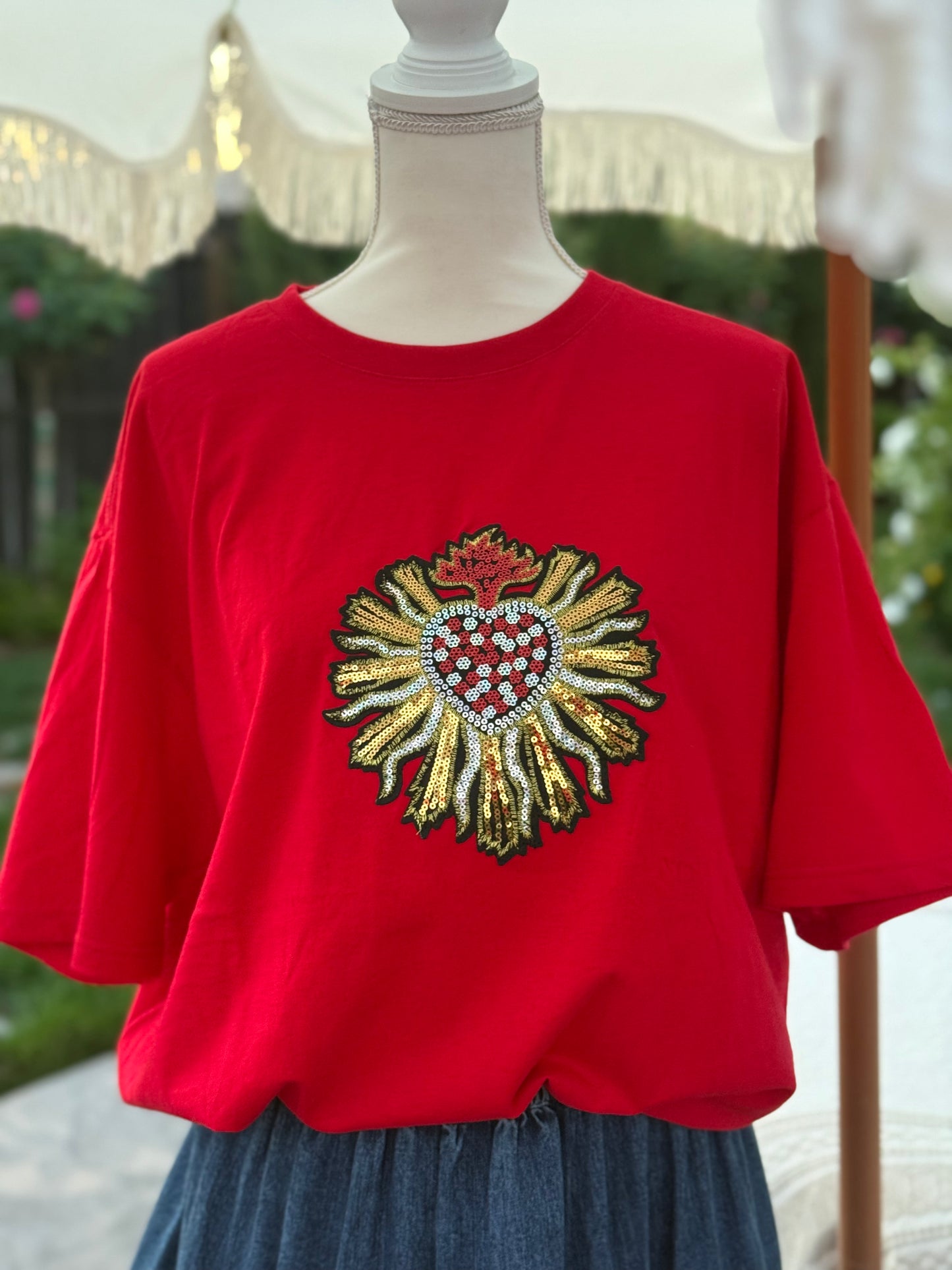 red top with gold heart